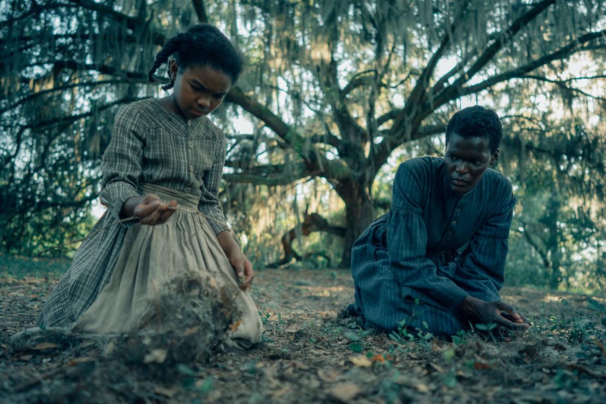Mikaela Kimani Armstrong as young Cora and Sheila Atim as her mother Mabel in “The Underground Railroad.” Cr: Amazon Studios