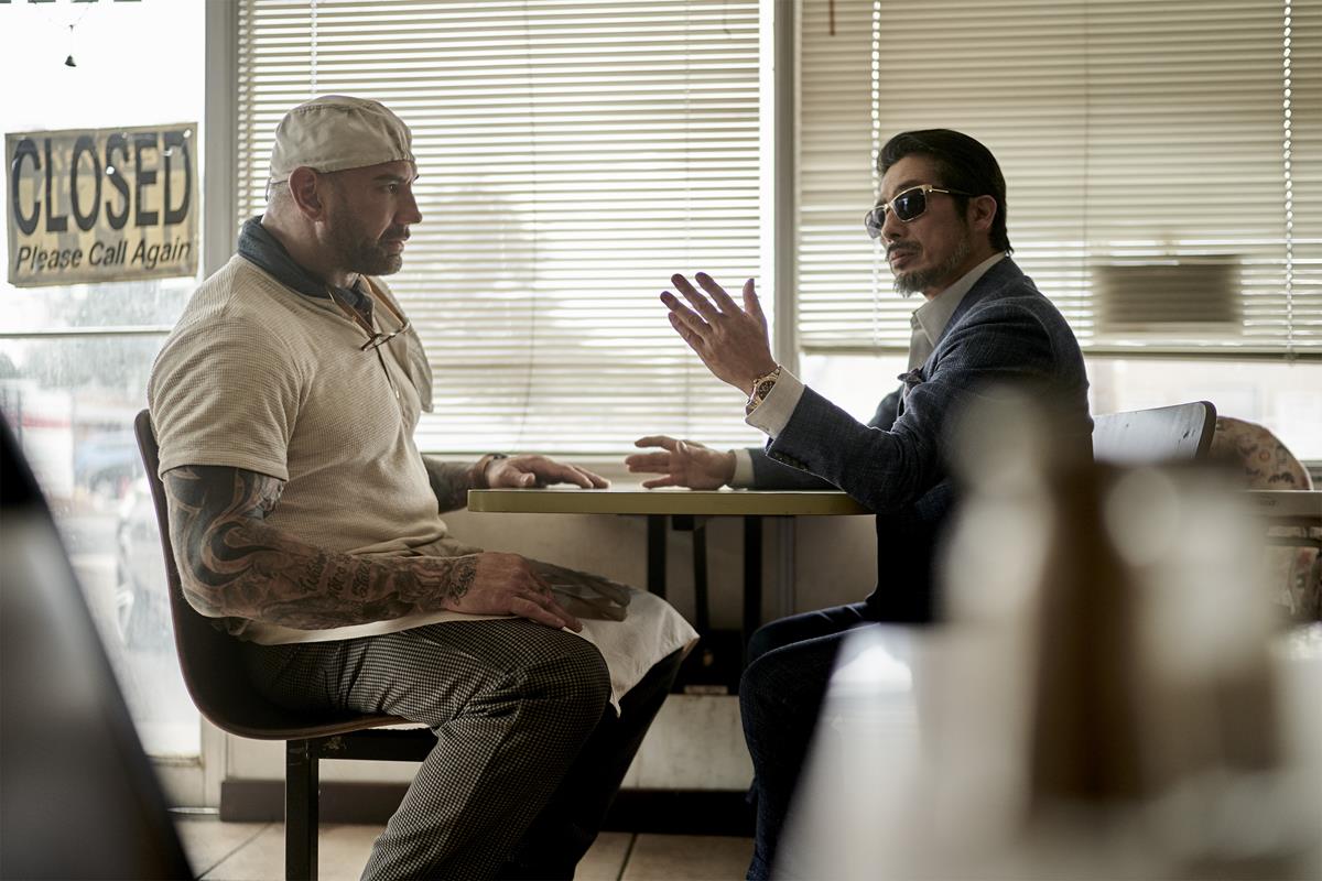 Dave Bautista as Scott Ward and Hiroyuki Sanada as Tanaka in “Army of the Dead,” written and directed by Zack Snyder. Cr: Clay Enos/Netflix