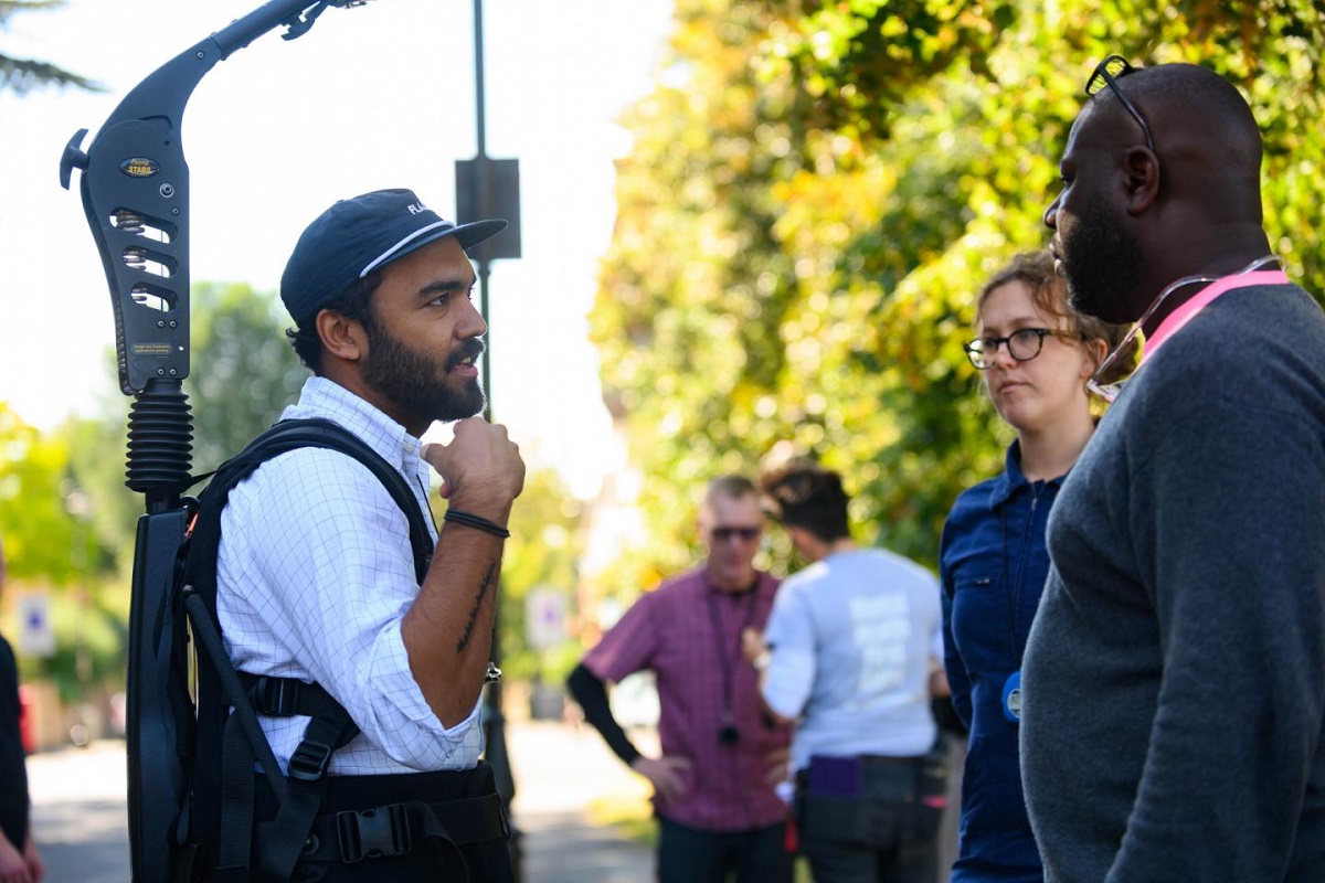 Cinematographer Shabier Kirchner with script supervisor Phoebe Billington and co-writer and director Steve McQueen on the set of “Lovers Rock.” Cr: Parisa Taghizedeh/Amazon Prime Video