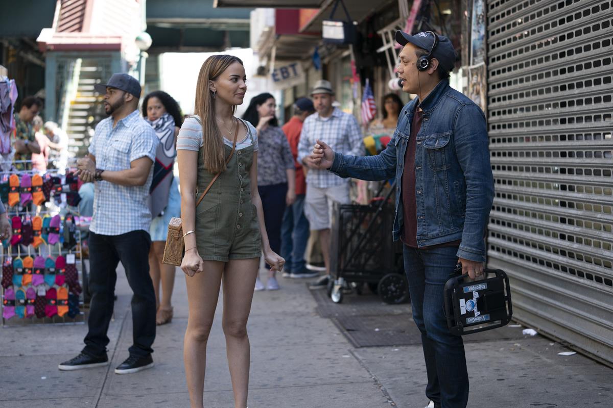 Leslie Grace and director Jon M. Chu on the set of the screen adaptation of “In The Heights.” Cr: Macall Polay/Warner Bros.