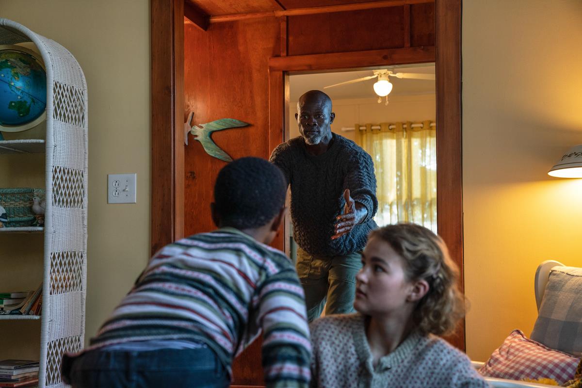 Man on Island (Djimon Hounsou) and Regan (Millicent Simmonds) brave the unknown in “A Quiet Place Part II.” Cr: Paramount Pictures