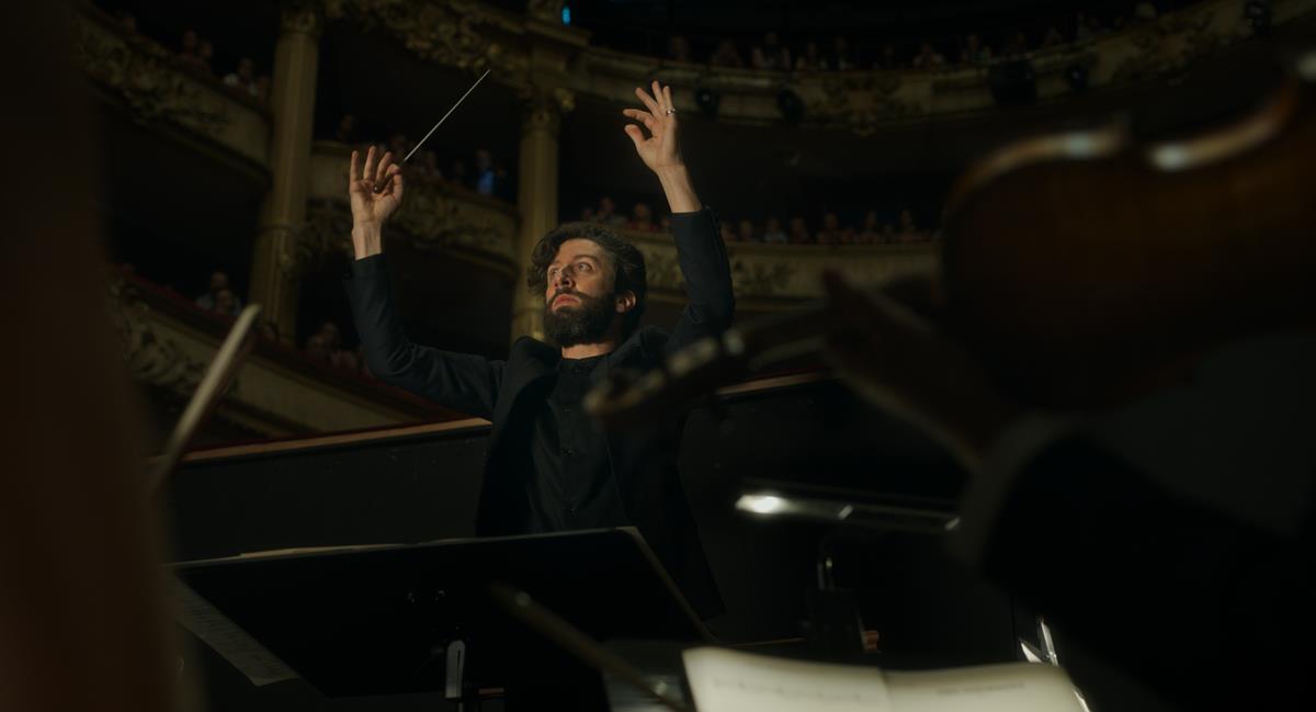 Simon Helberg as The Conductor in director Leos Carax’s “Annette.” Cr: Kris Dewitte/Amazon Studios