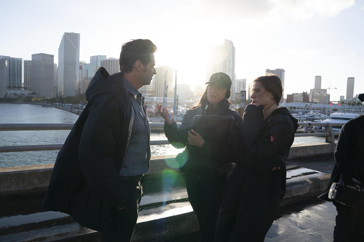 Hugh Jackman, director Lisa Joy, and Rebecca Ferguson on the set of “Reminiscence.” Cr: Warner Bros. Pictures