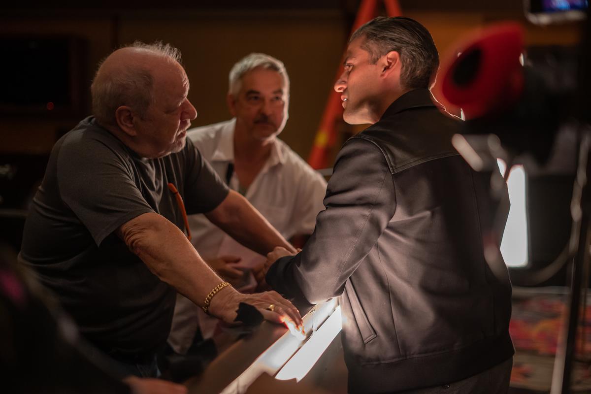 Director Paul Schrader, first AD Martin Jedlicka, and Oscar Isaac on the set of “The Card Counter.” Cr: Focus Features
