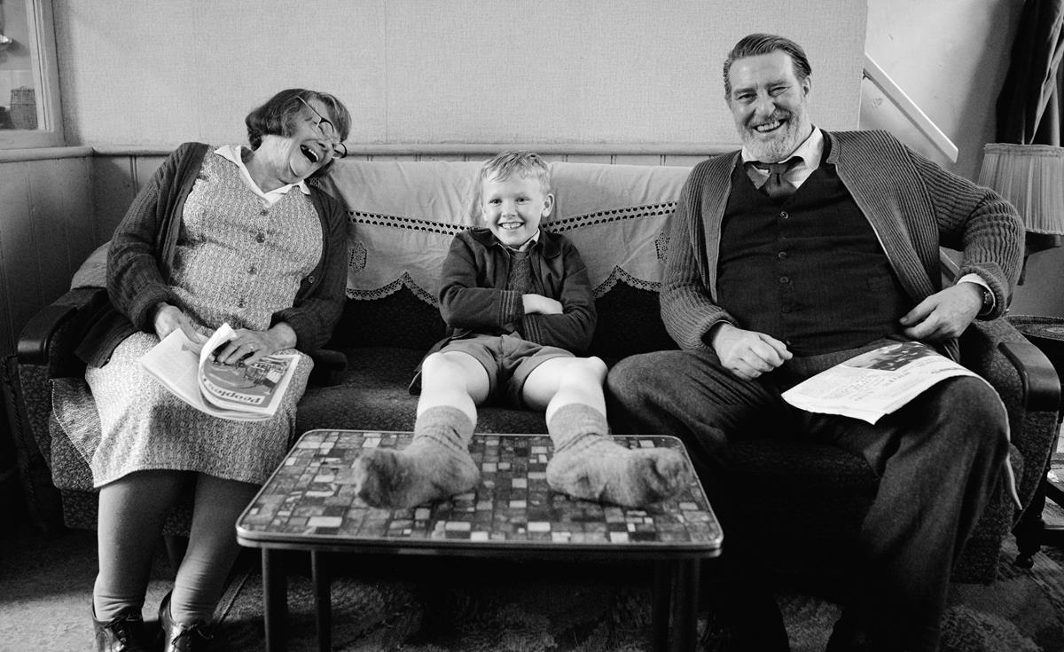 Judi Dench as Granny, Jude Hill as Buddy and Ciarán Hinds as Pop in director Kenneth Branagh's “Belfast.” Cr: Focus Features