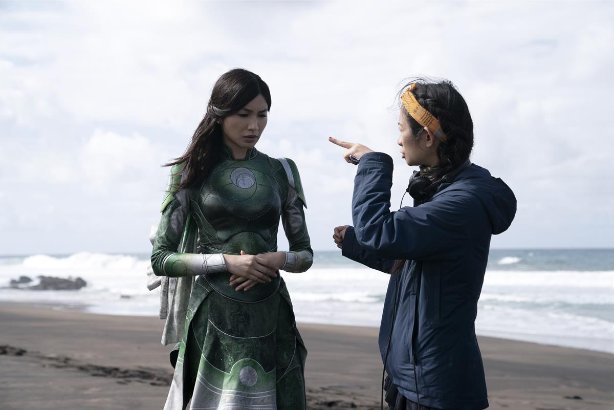 Gemma Chan and director Chloé Zhao on the set of “Eternals.” Cr: Marvel Studios