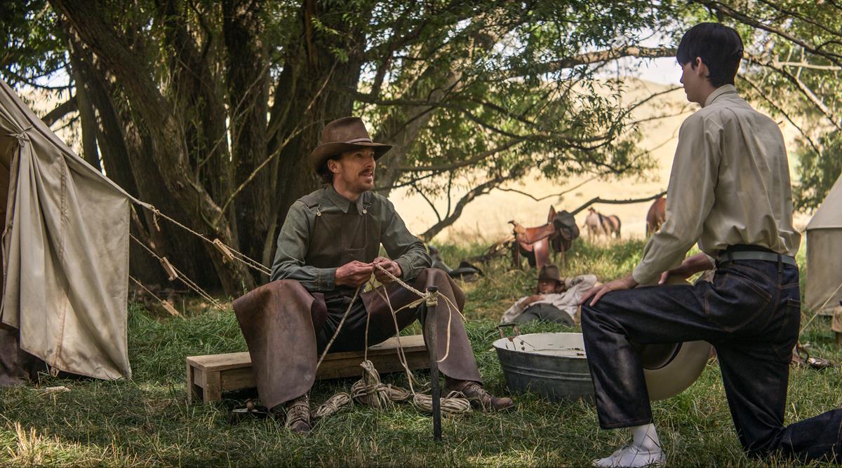 Benedict Cumberbatch as Phil Burbank and Kodi Smit-McPhee as Peter in “The Power of the Dog,” directed by Jane Campion. Cr: Kirsty Griffin/Netflix