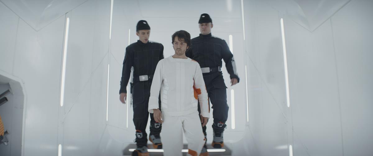Diego Luna as Cassian Andor with delivery guards Kenny Fullwood and Josh Herdman in “Andor.” Cr: Disney+