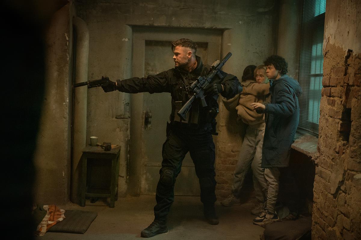 Chris Hemsworth as Tyler Rake, Miriam and Marta Kovziashvili as Nina, Tinatin Dalakishvili as Ketevan and Andro Jafaridze as Sandro in “Extraction 2.” Cr: Jasin Boland/Netflix