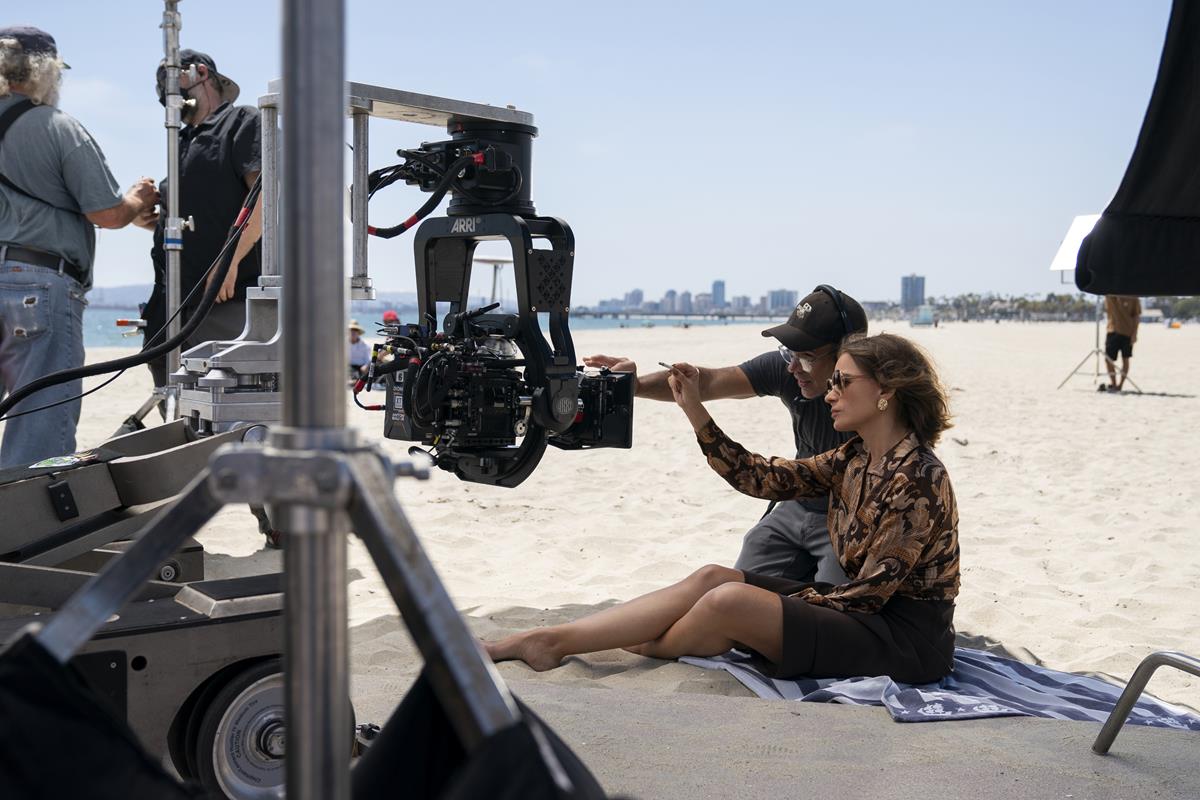 Director of photography Armando Salas and Sofia Vergara behind the scenes of “Griselda.” Cr: Elizabeth Morris/Netflix